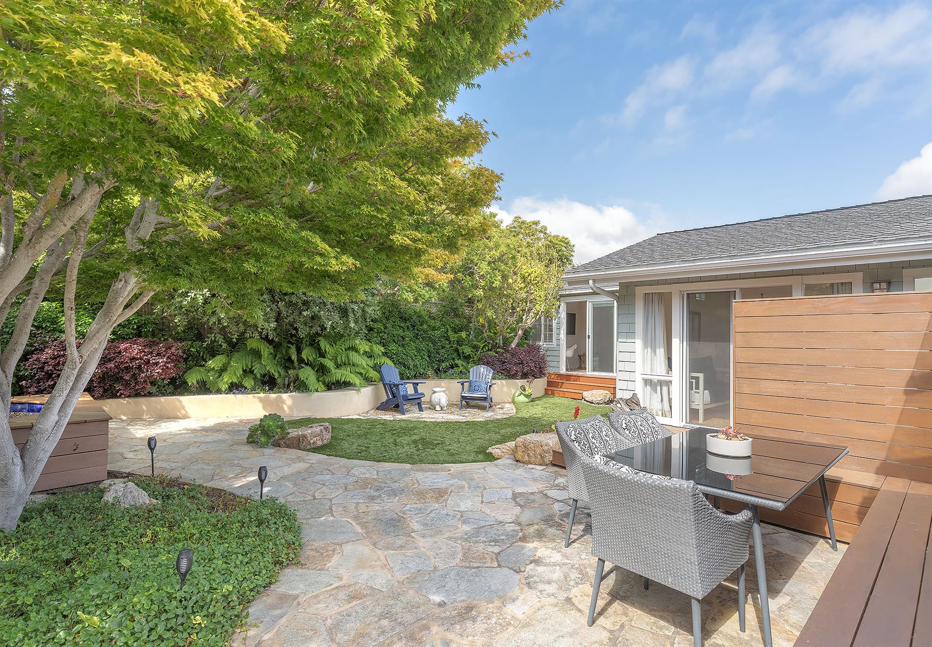 Backyard with Gas BBQ Grill Dining Area and a Hot Tub