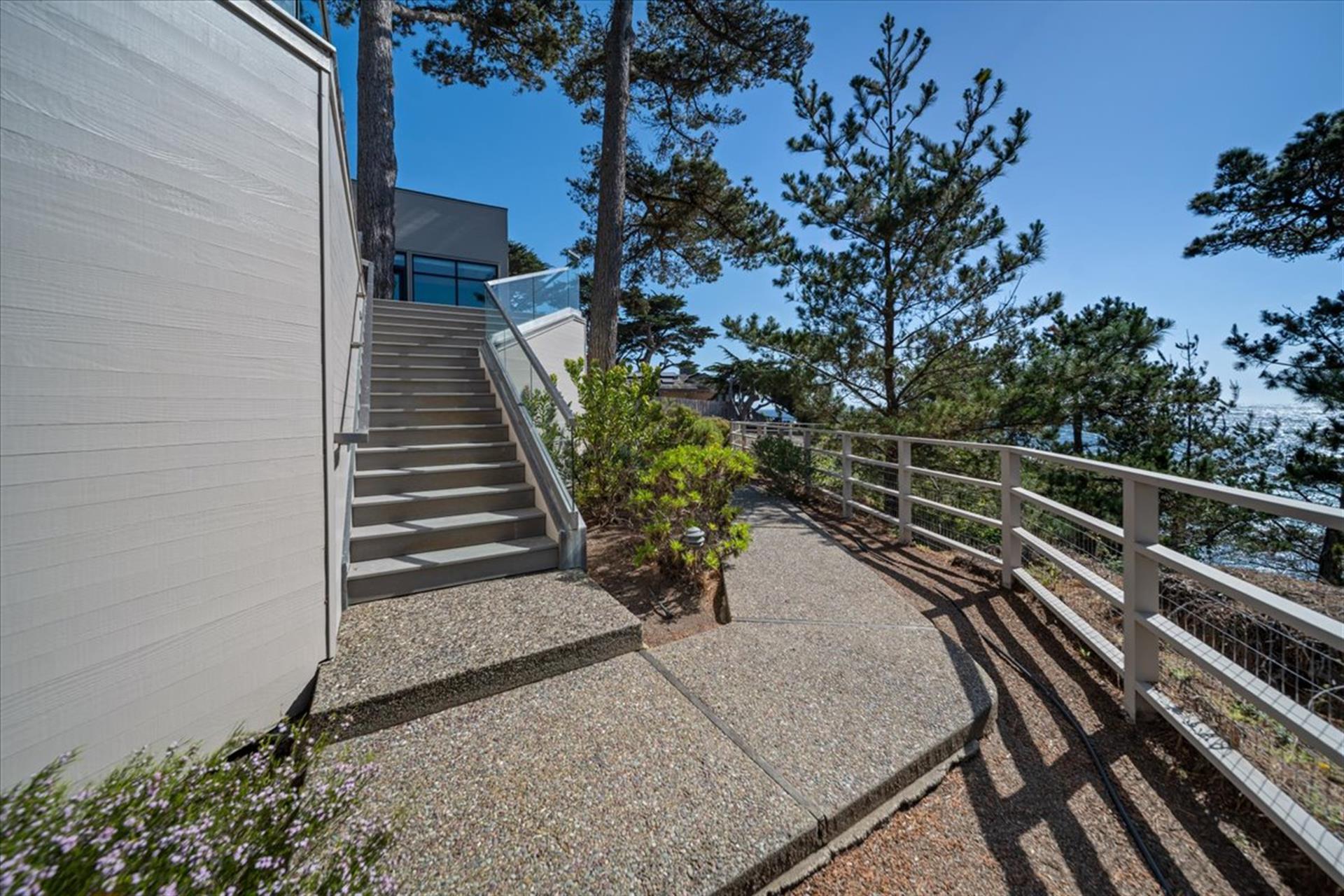 Steps from the Deck Lead Down to a Coastal Garden Area