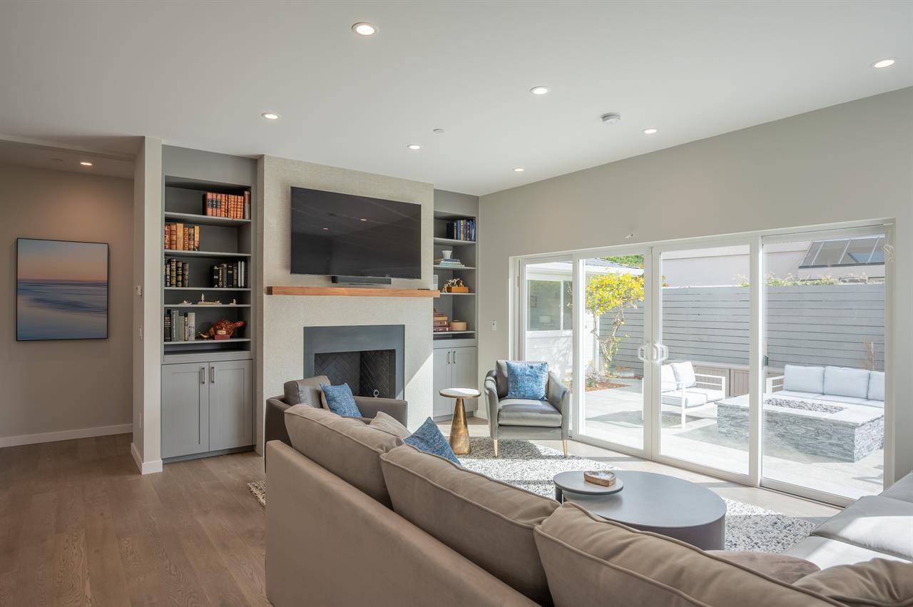 Living Room with TV, Wood Burning Fireplace, Patio Access
