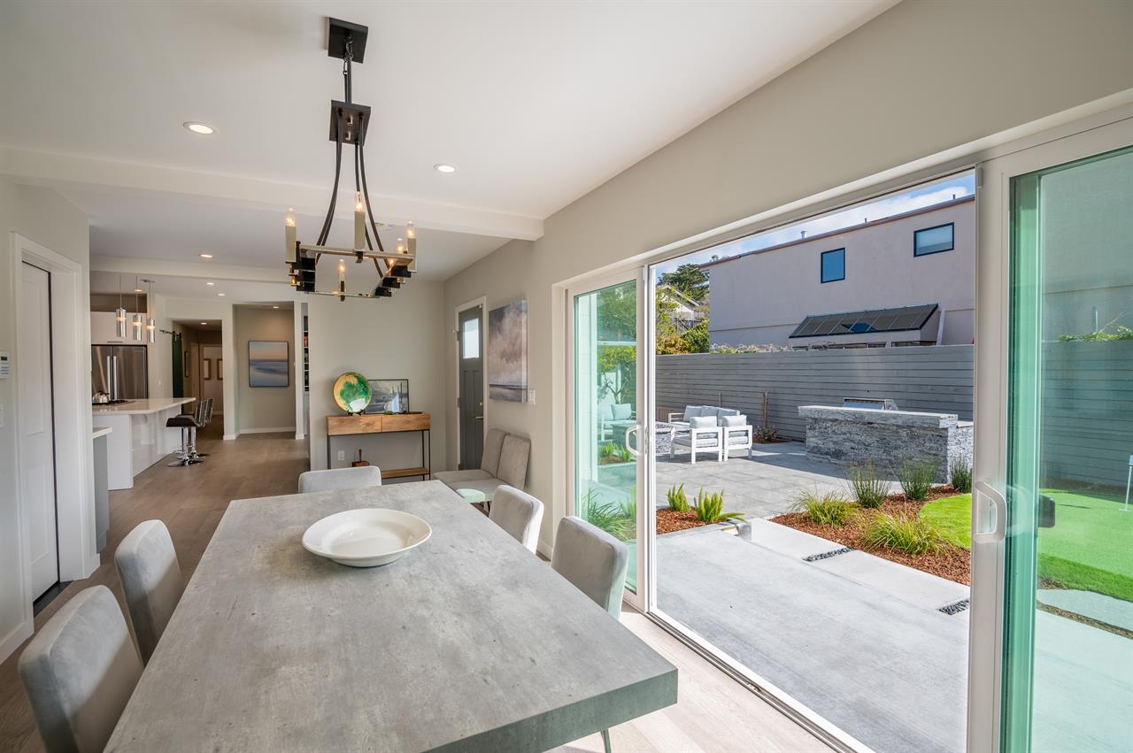 Double Sliding Doors Open to the Patio and Barbecue Area