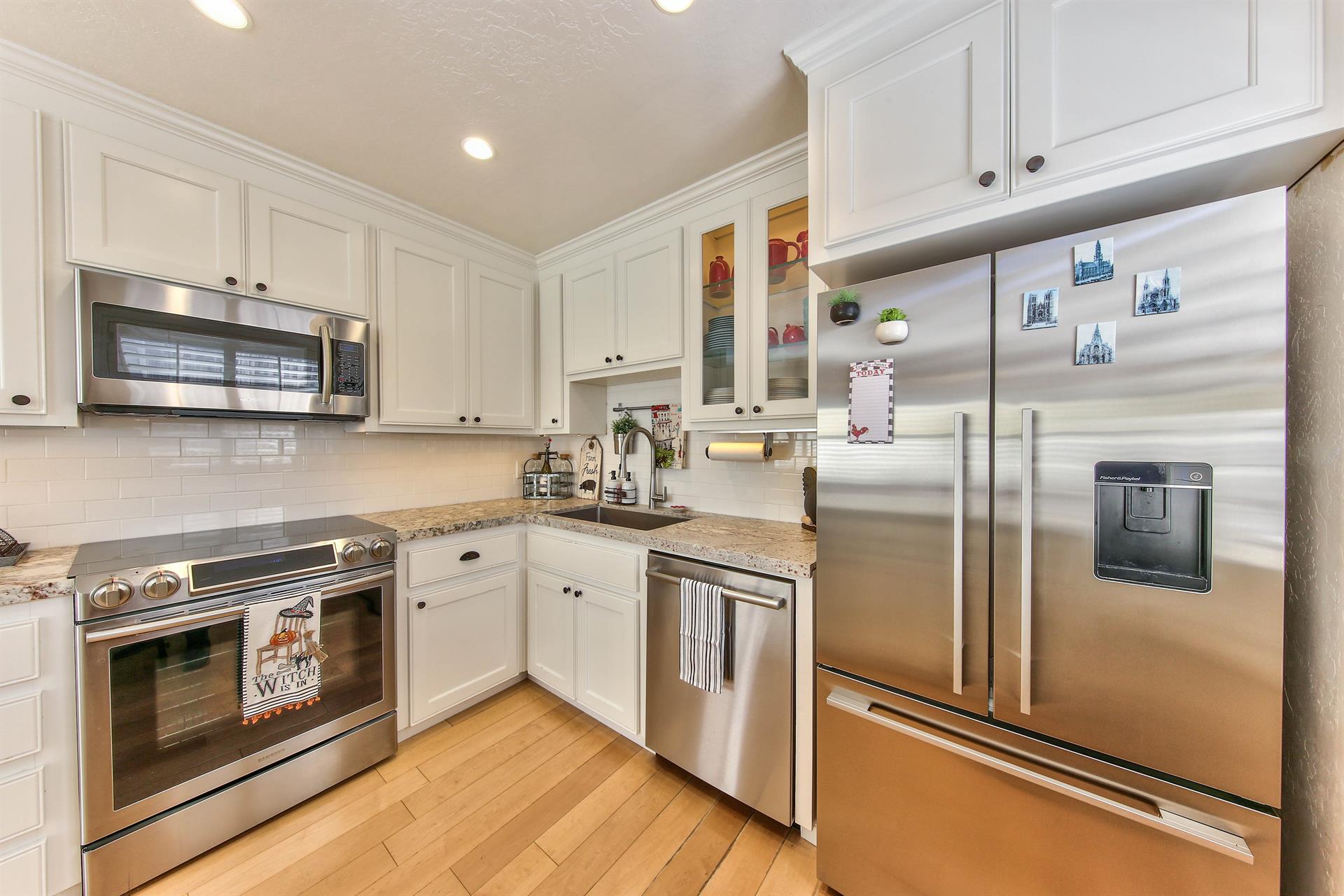 Immaculate Kitchen with Stainless Steel Appliances