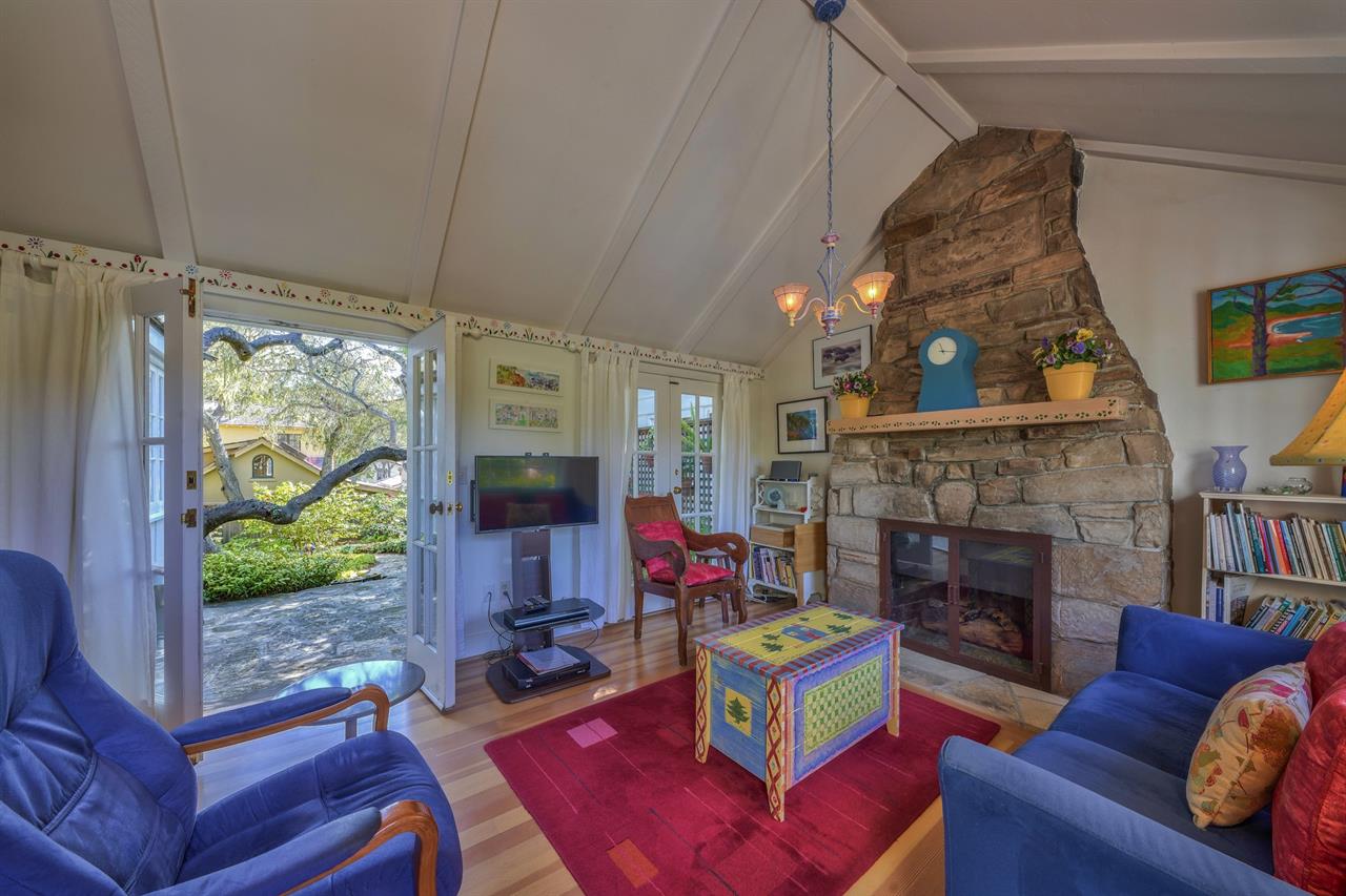 Cozy, Colorful Living Space with Gas Fireplace, TV, Patio Access