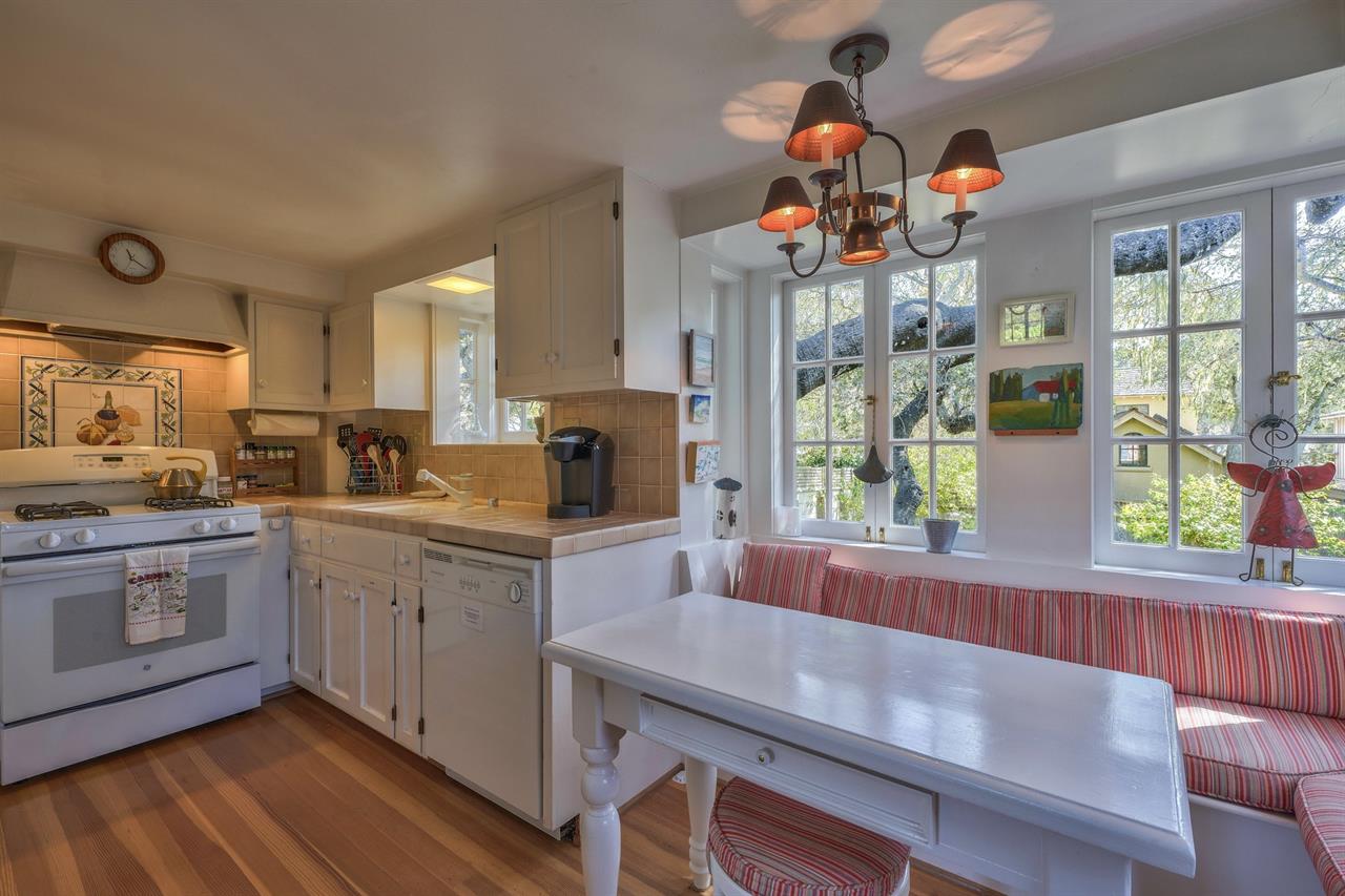 Charming Kitchen with Banquet Seating