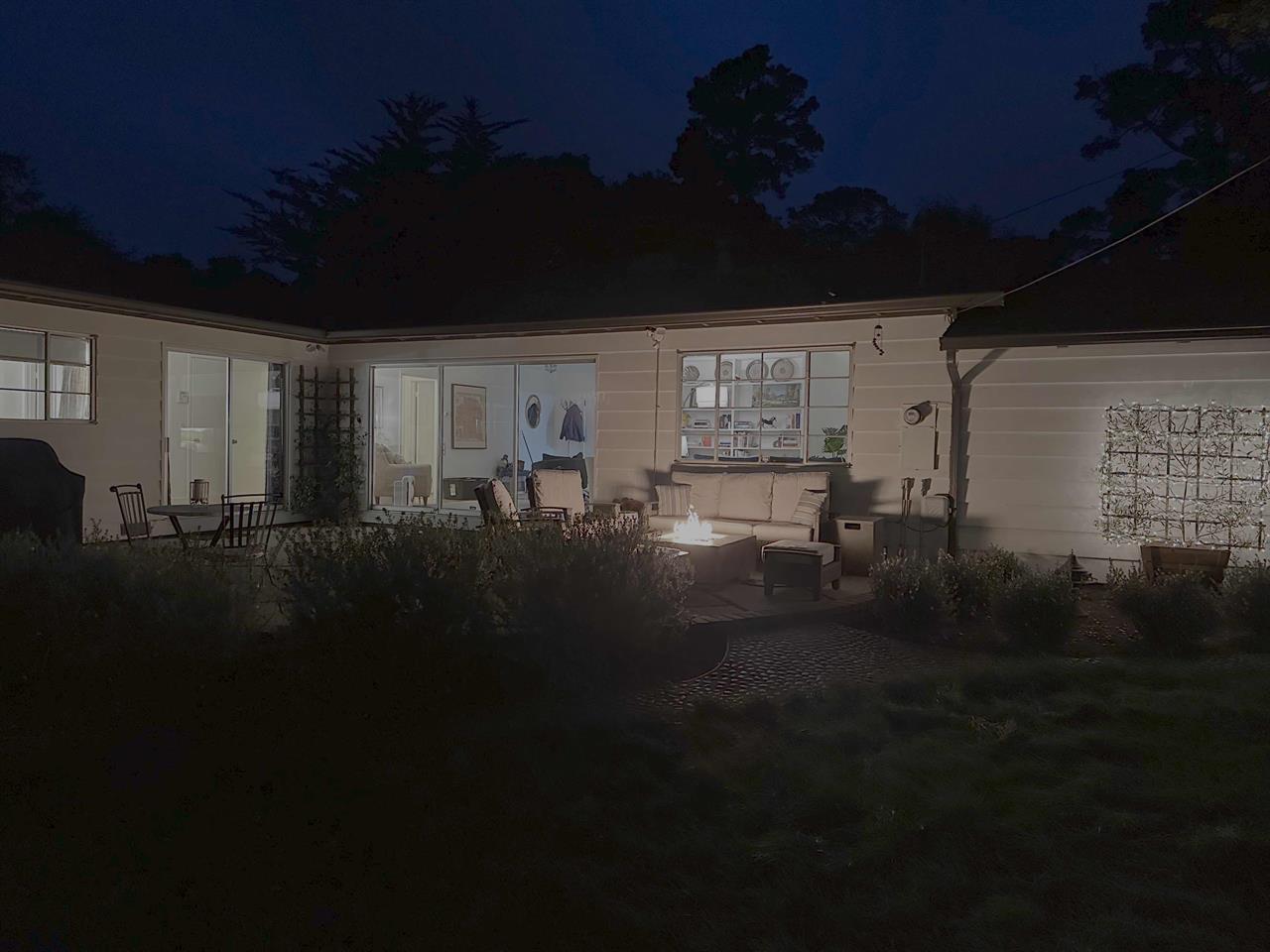 Backyard Patio with Fire Pit at Night