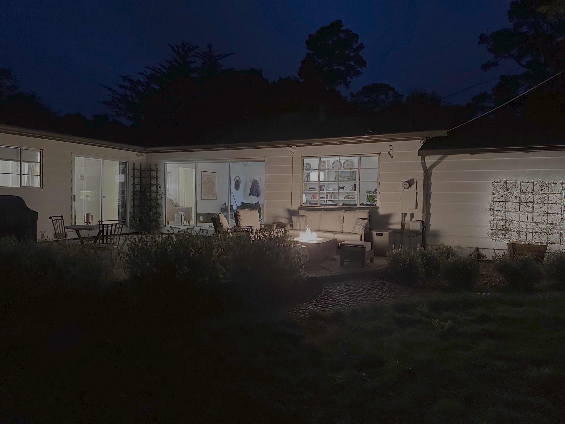Backyard Patio with Fire Pit at Night