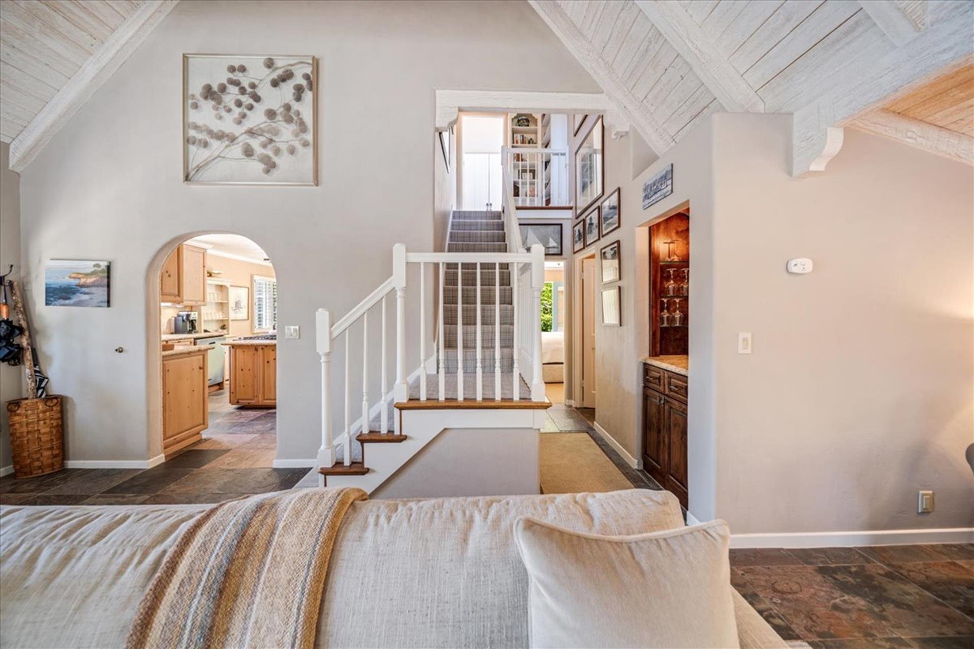 Stairs Lead Up to a Bedroom and Full Bath
