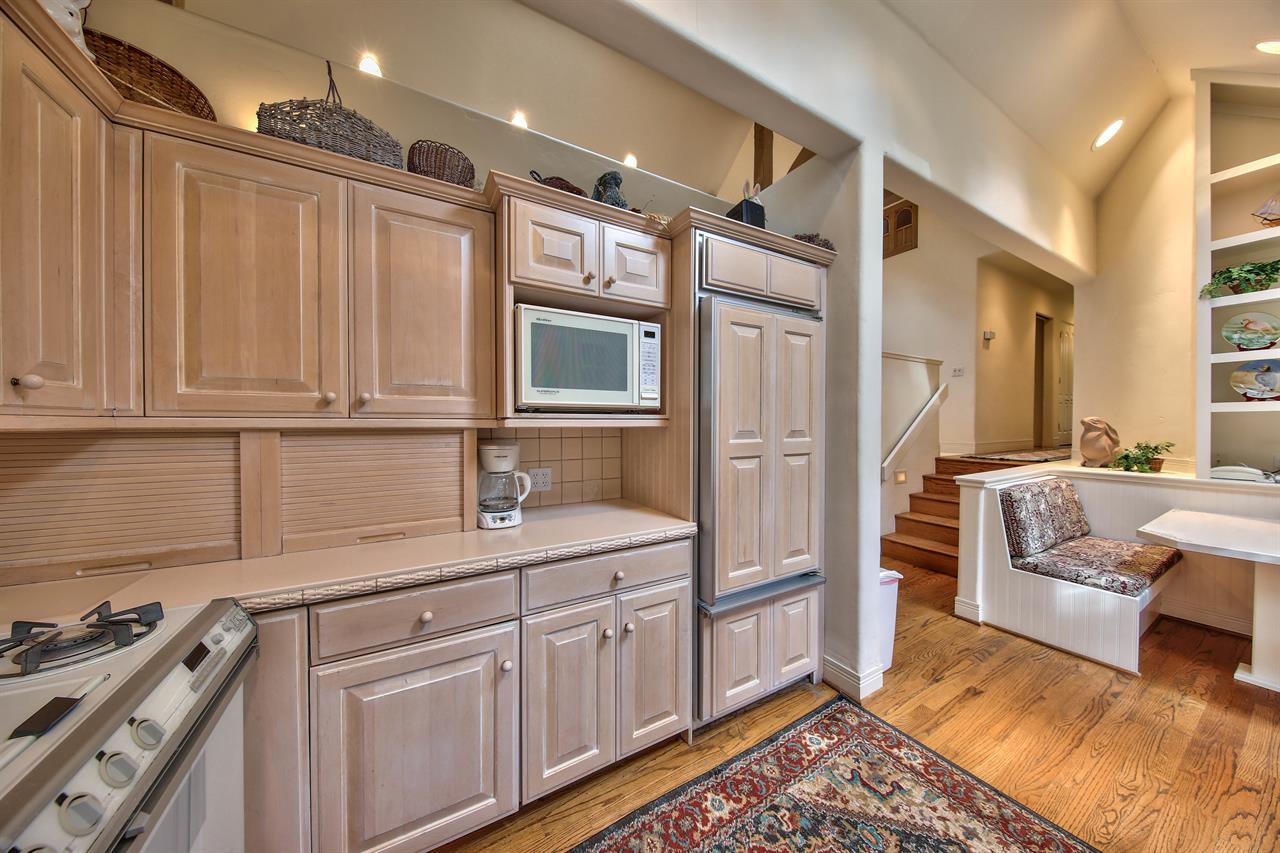 Kitchen with Gas Stove, Charming Banquette Seating Area