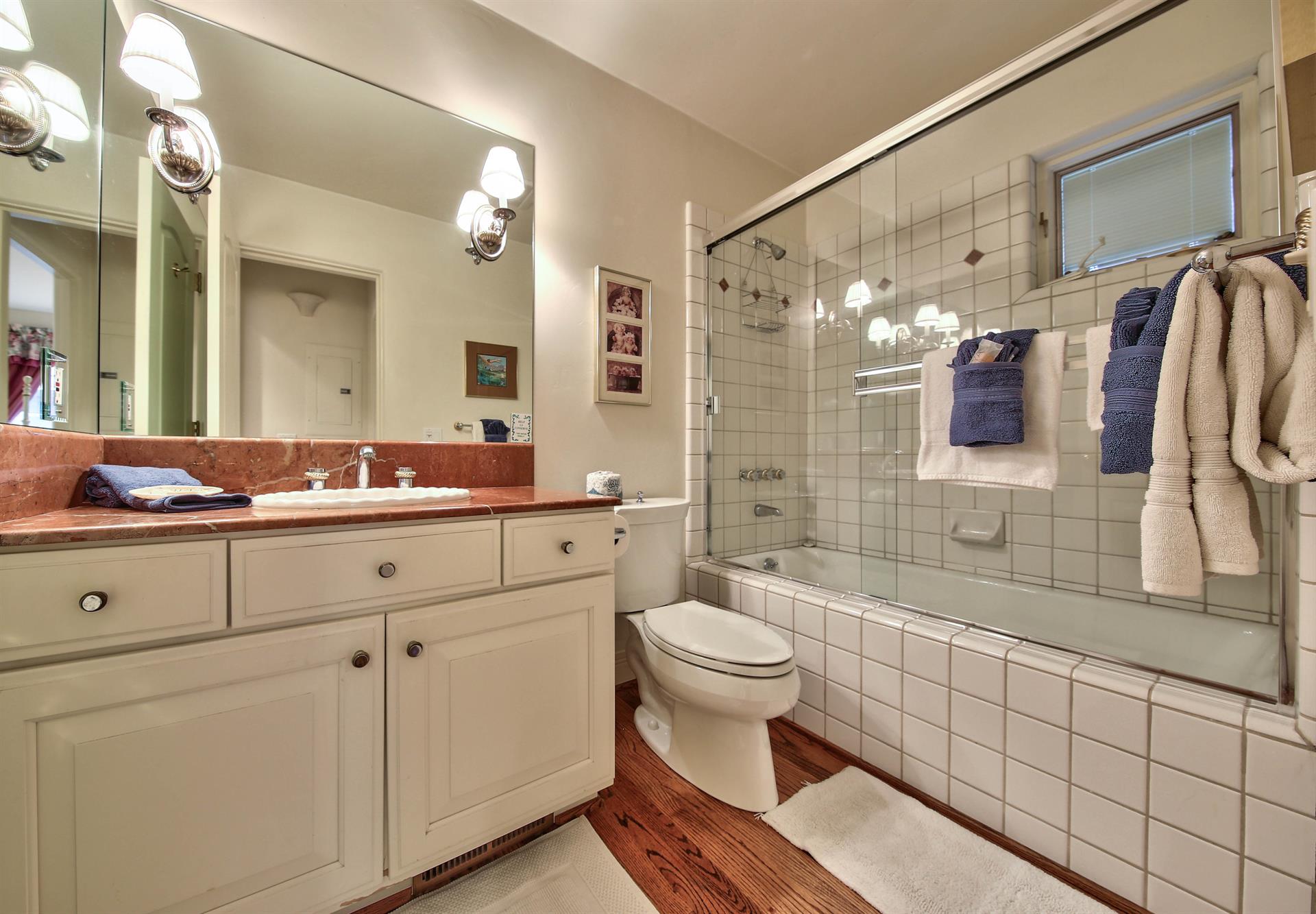 Full Hall Bathroom with a ShowerOverTub with Jets
