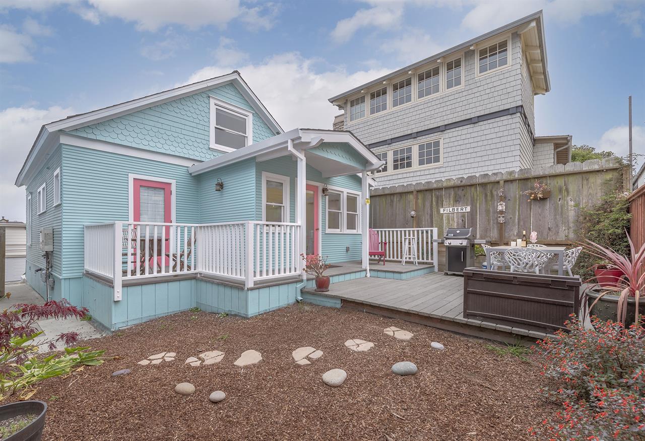 Backyard has a Gas Grill and Dining Area