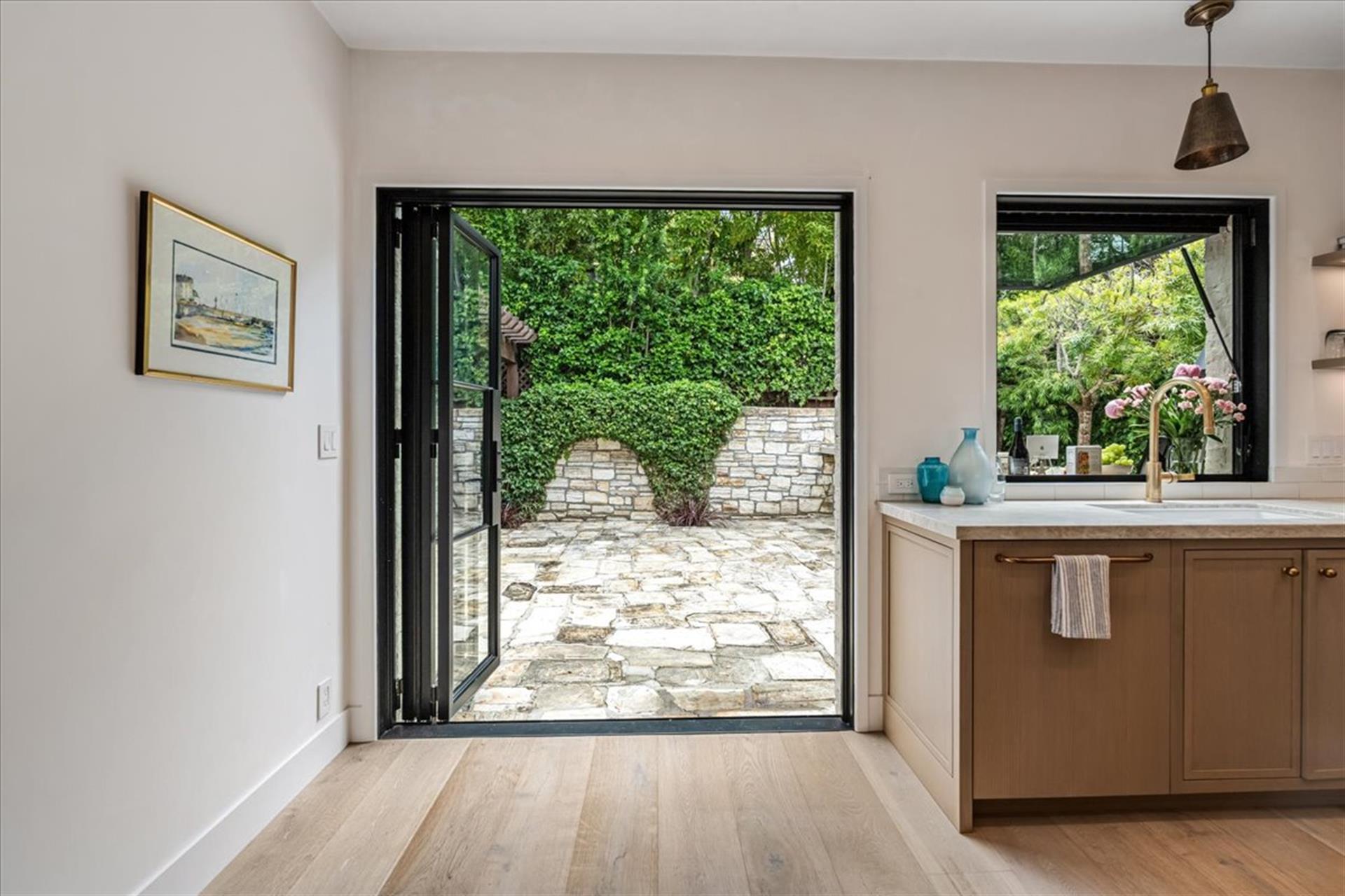 Folding Glass Doors Lead to the Spacious Backyard Patio