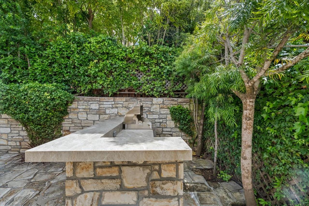 Outdoor Kitchen has a Gas BBQ Grill