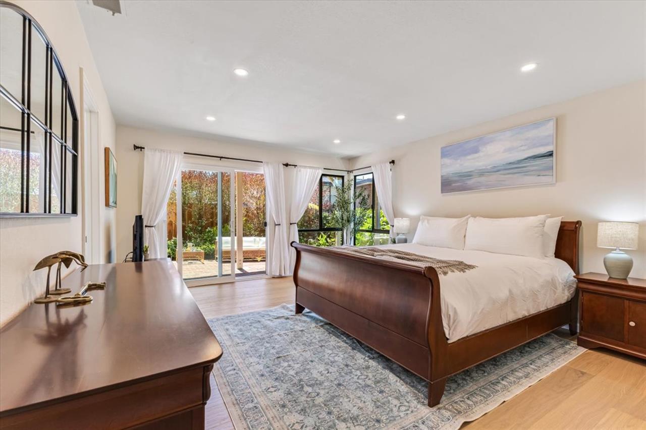 Bedroom 2 has a Cal King Bed and Access to the Backyard Patio