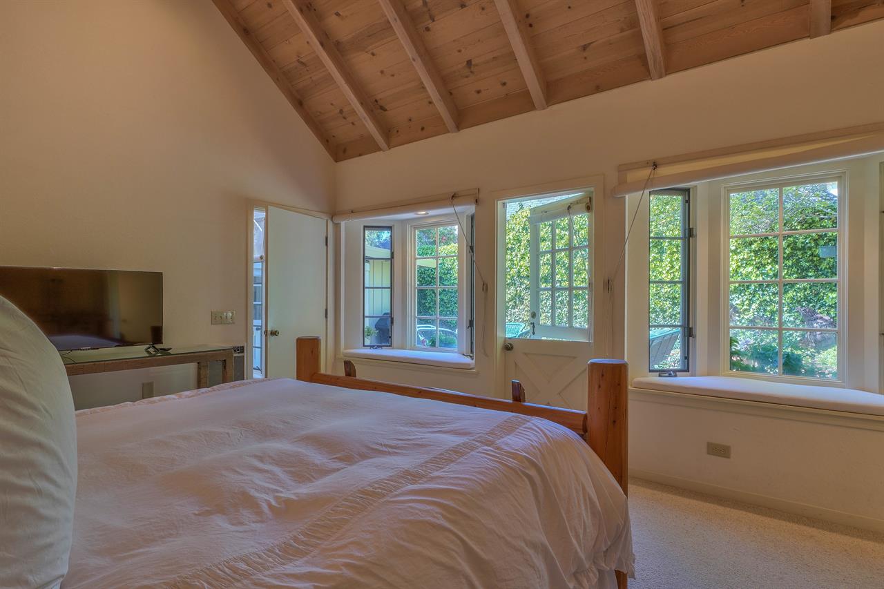 Bedroom 1, King Bed, TV, Dutch Door to Patio, Window Seat
