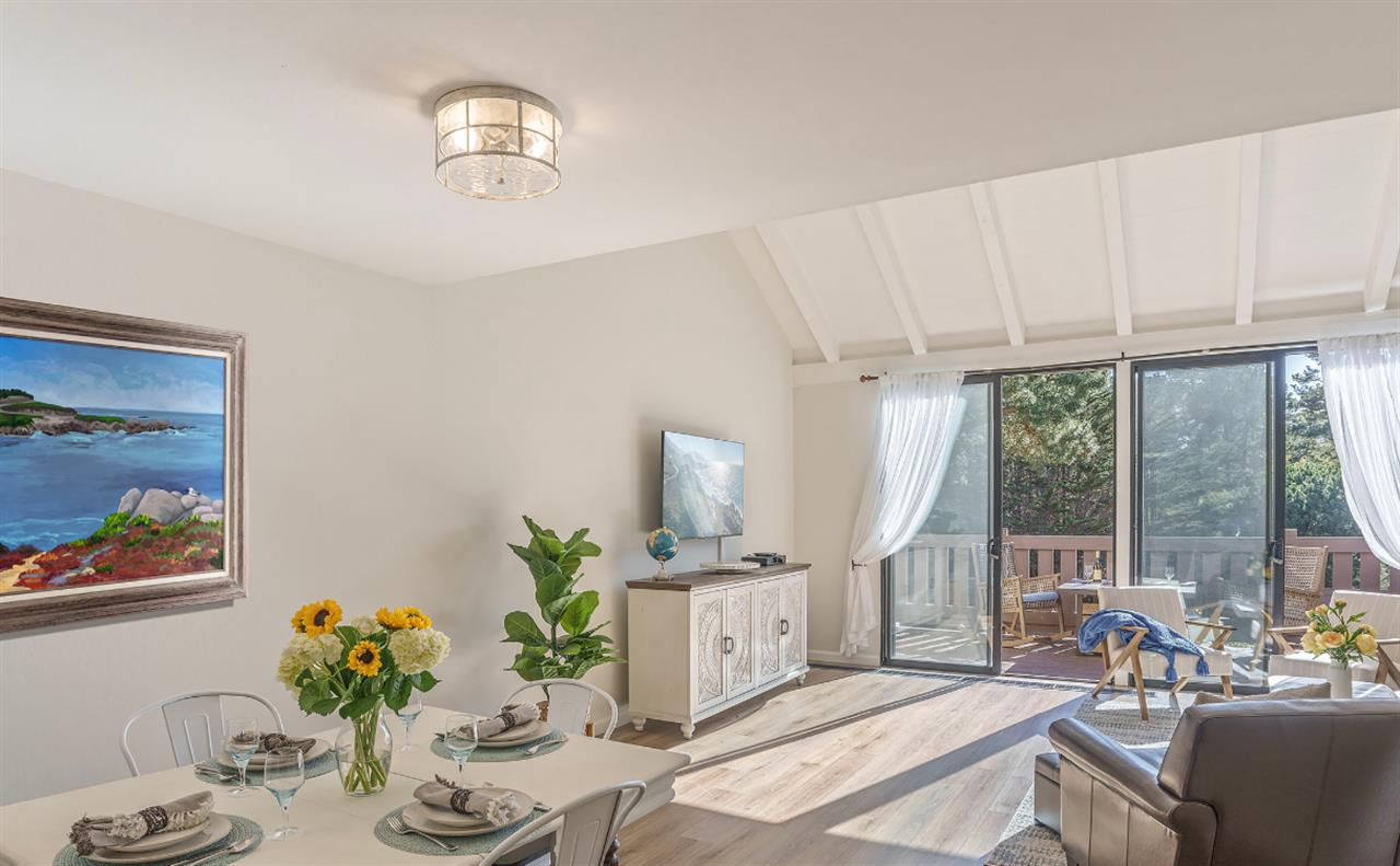 Living Room with HDTV, Balcony and Vaulted Ceiling