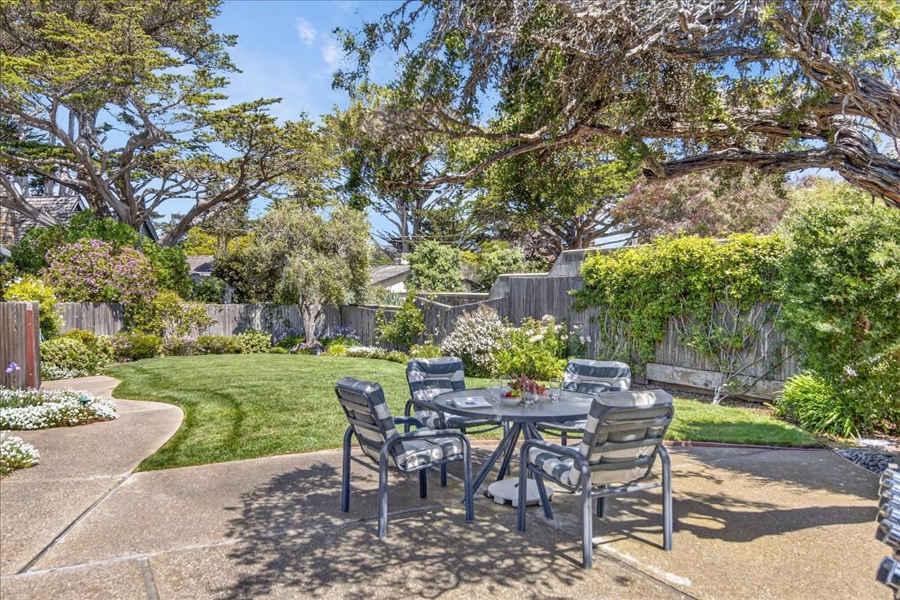 Beautifully Landscaped Backyard with Dining Area and Gas BBQ