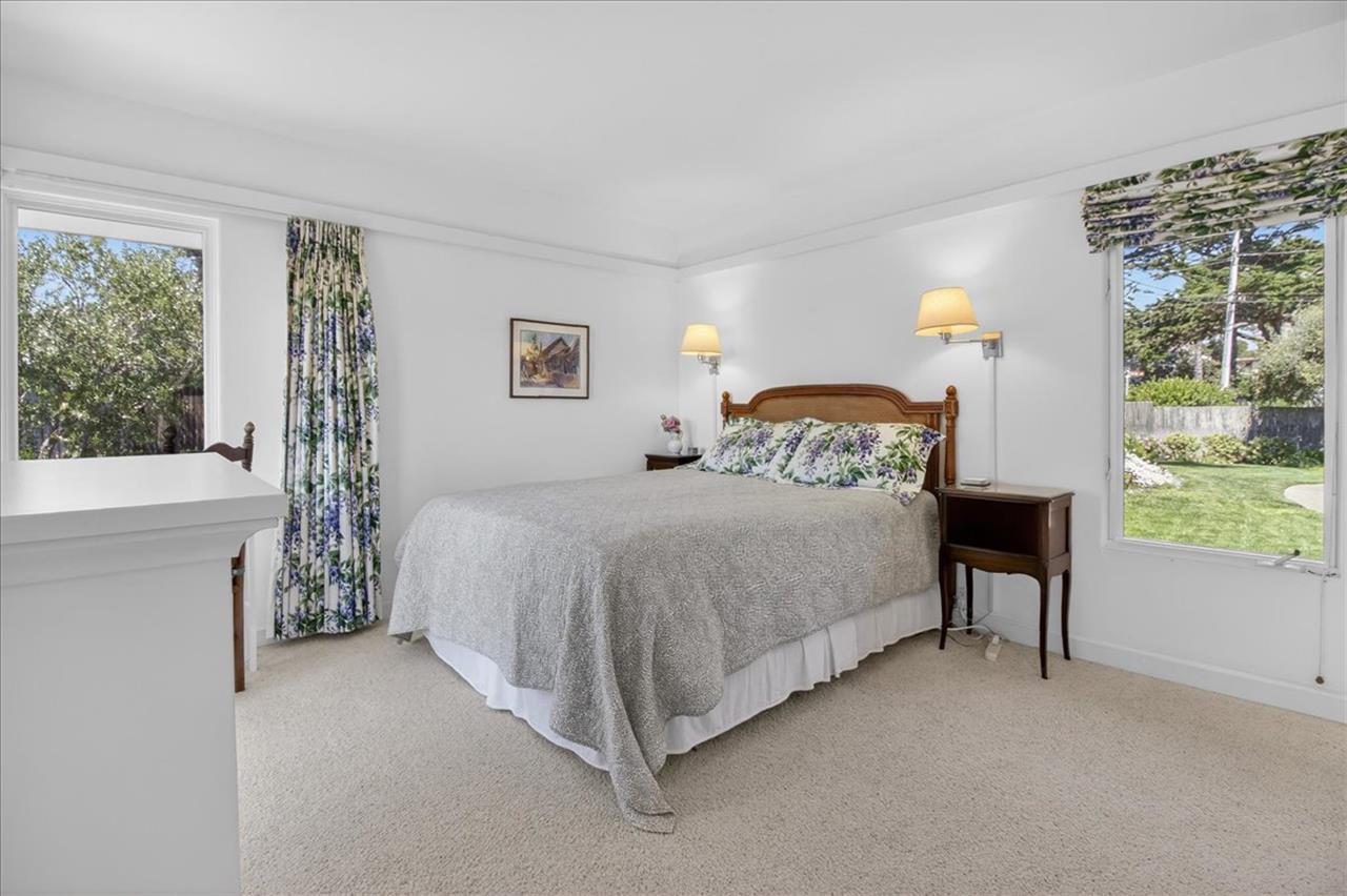 Bedroom 2 has a Queen Bed and EnSuite Bath with a Shower
