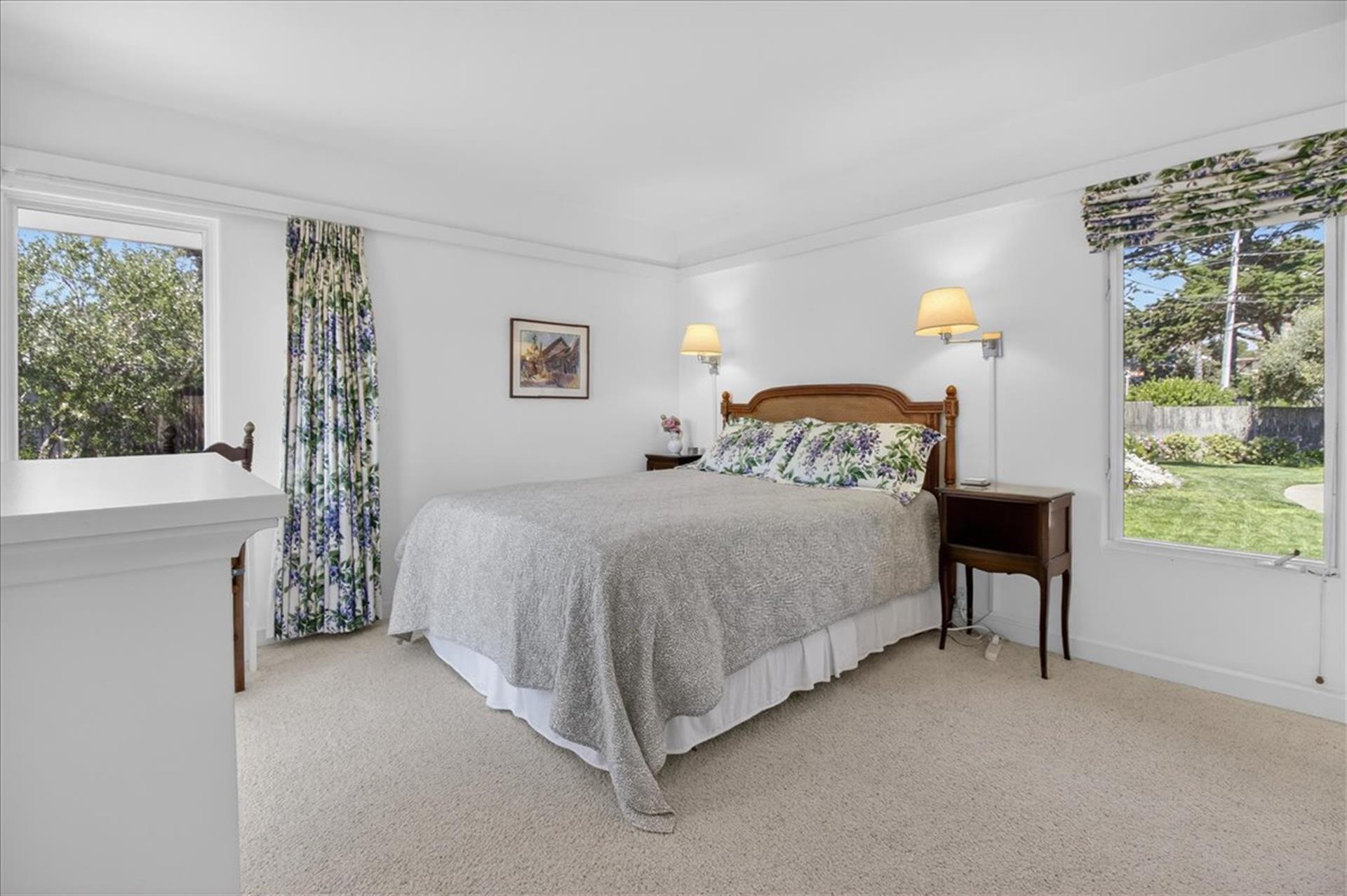 Bedroom 2 has a Queen Bed and EnSuite Bath with a Shower