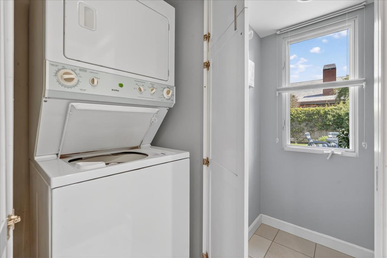 A Stacked Washer  Dryer is in the Home