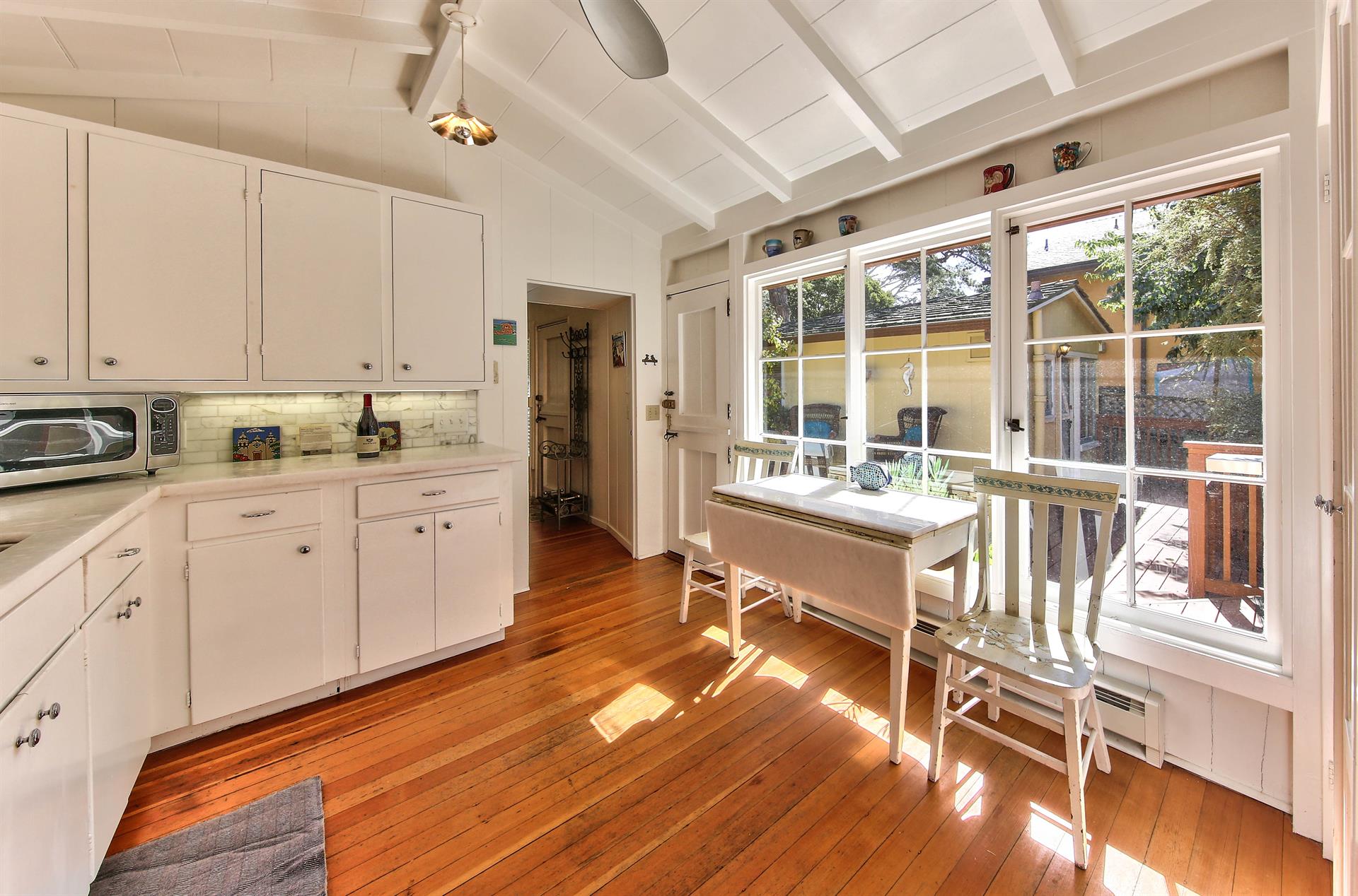 Kitchen Has Direct Access to Deck and Patio