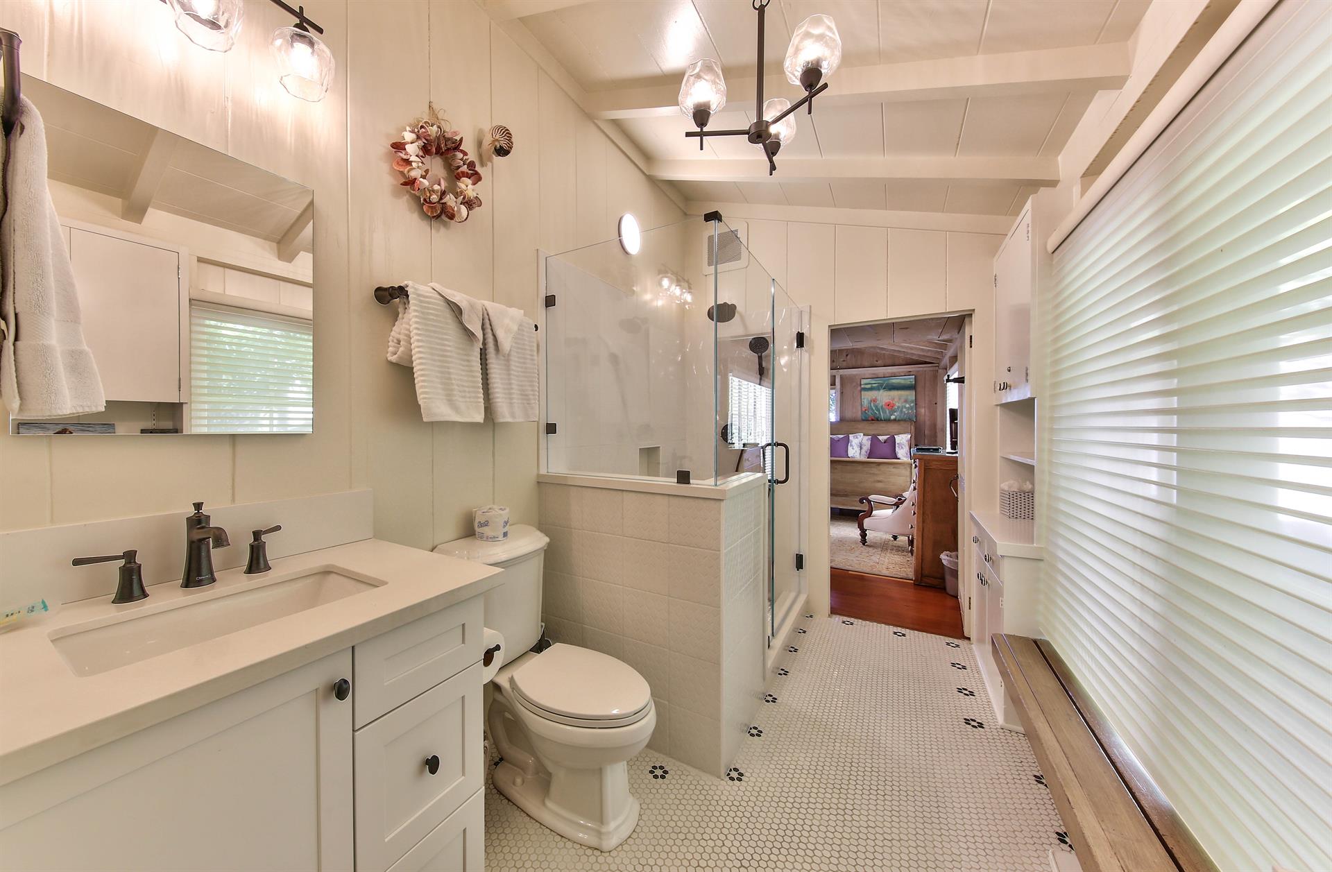 Shared Hall Bathroom with Standing Shower In Main House