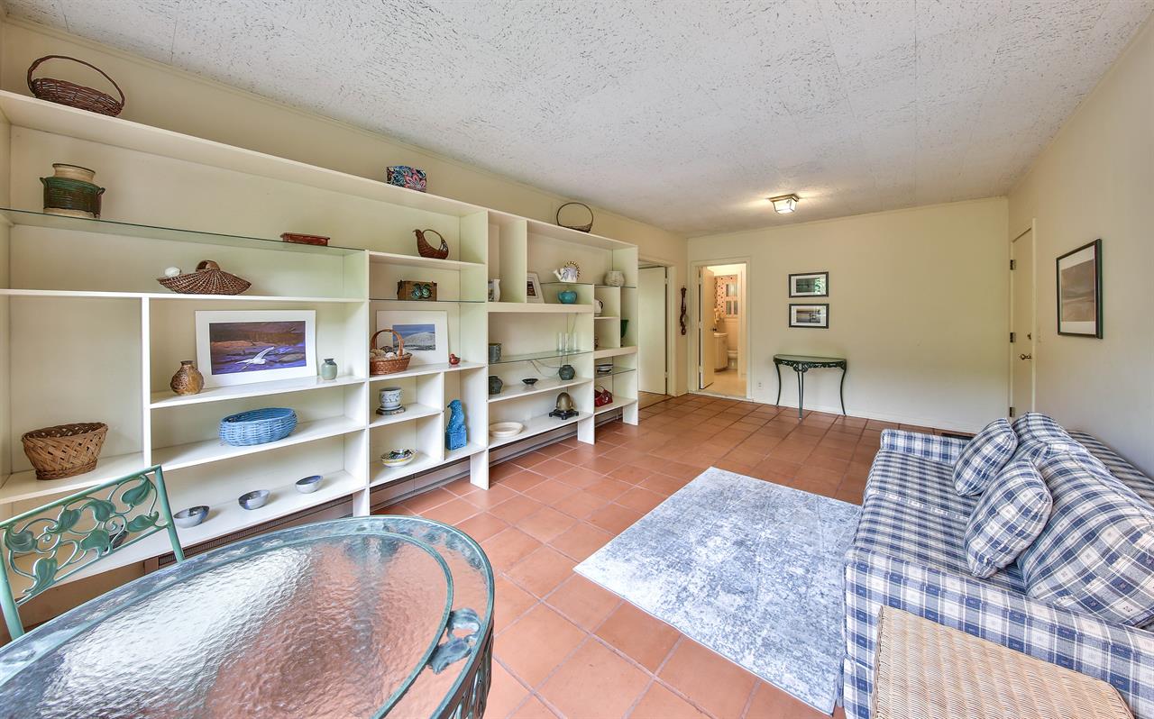 Den with Saltillo Tile Floor, Love Seat and Bistro Table