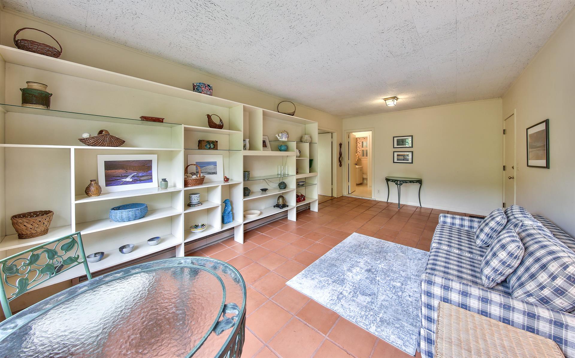 Den with Saltillo Tile Floor, Love Seat and Bistro Table