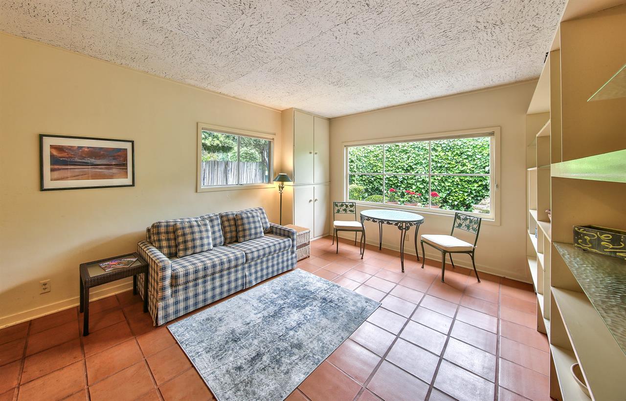 Den with Saltillo Tile Floor, Love Seat, Bistro Table and Chairs
