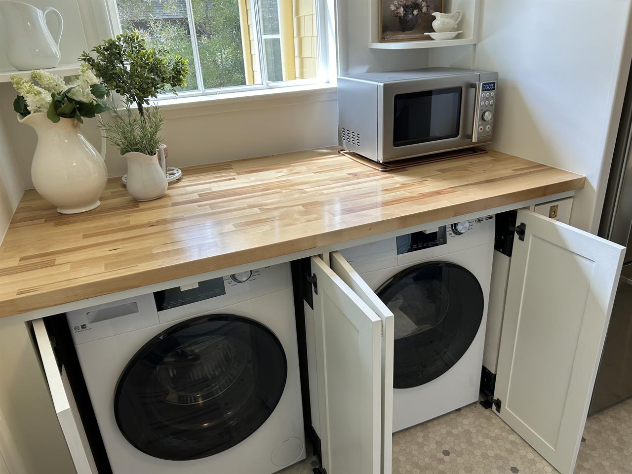 Laundry Center is Conveniently Tucked Into Kitchen Cabinets