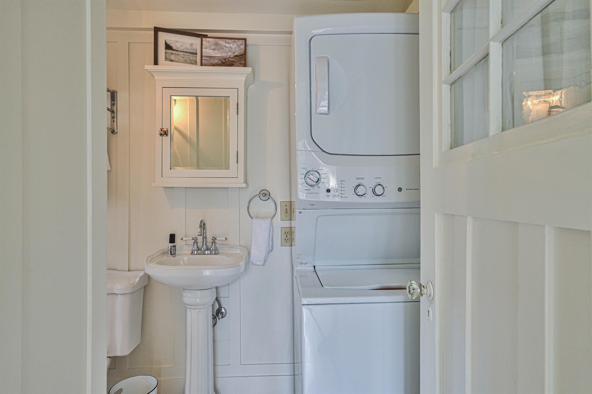 Full Hall Bathroom with Shower and Stacked WasherDryer