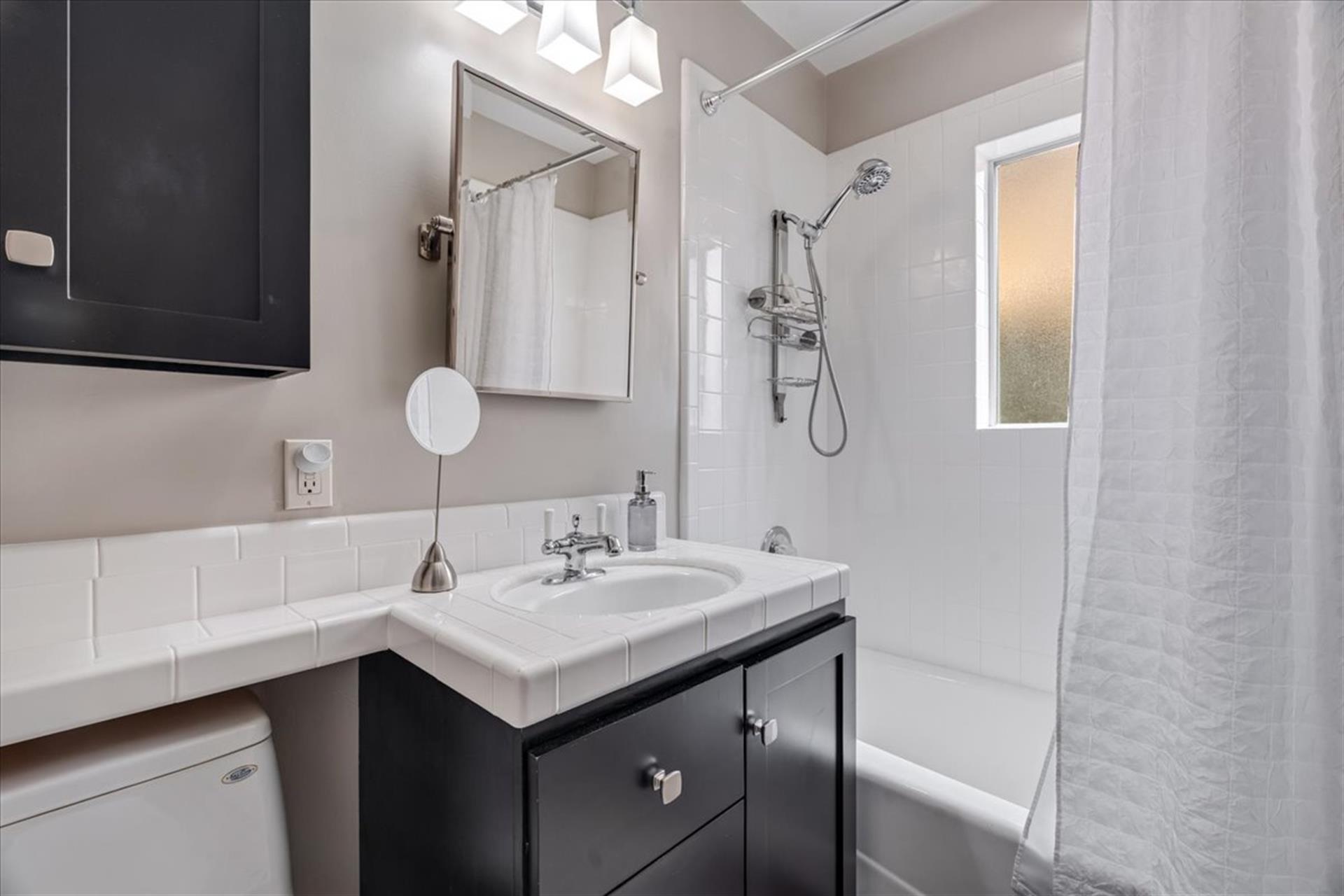 Hall Bathroom has a Shower Over Tub Combo