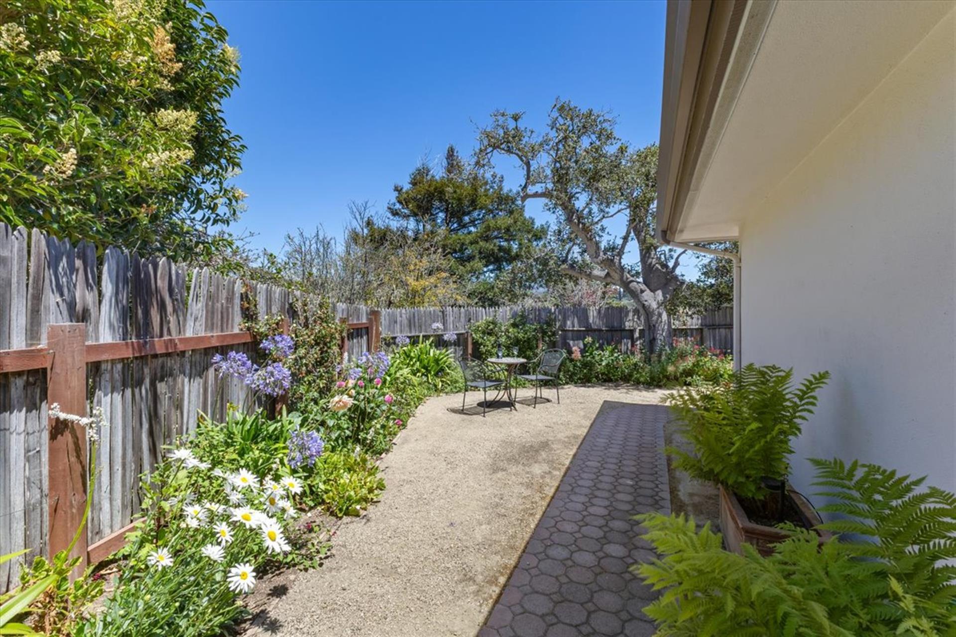 Lovely Gardens, Patios and Seating Areas Surround the Home