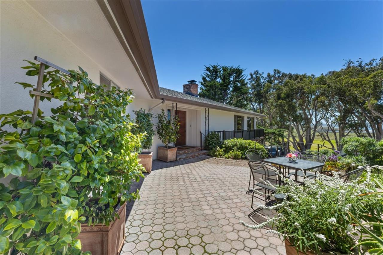 Lovely Gardens, Patios and Seating Areas Surround the Home