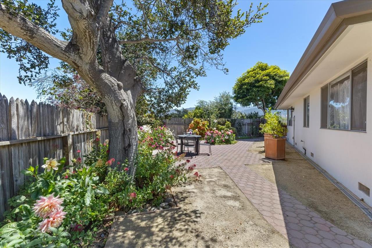 Lovely Gardens, Patios and Seating Areas Surround the Home