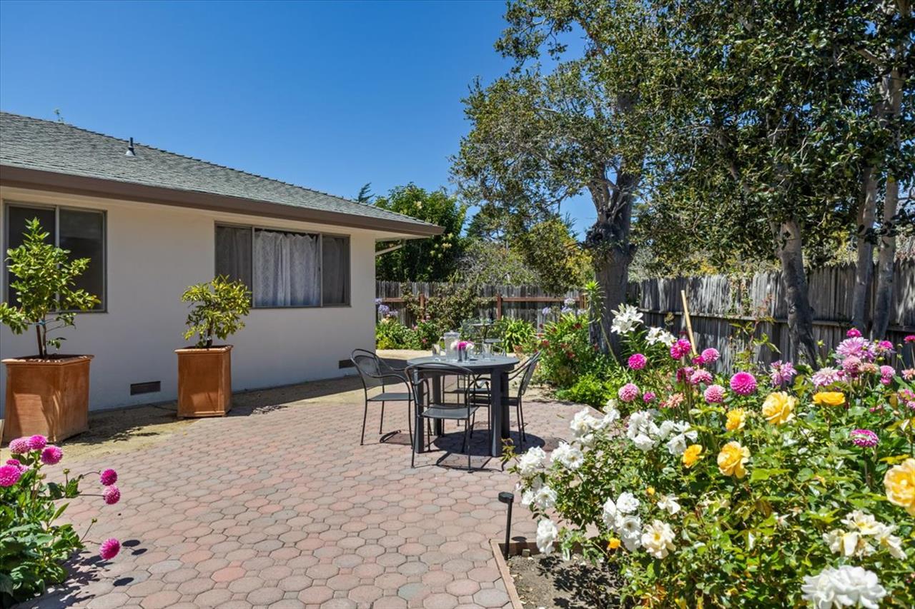 Lovely Gardens, Patios and Seating Areas Surround the Home