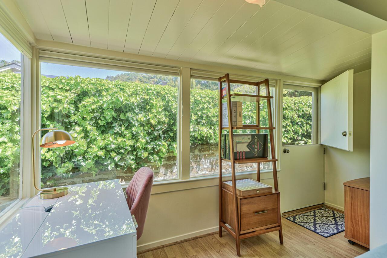 A Cozy Work Area with Desk and Peek of the Ocean
