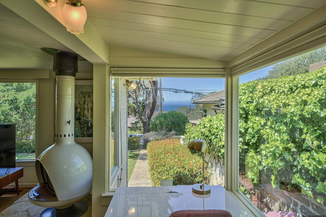 A Cozy Work Area with Desk and Peek of the Ocean