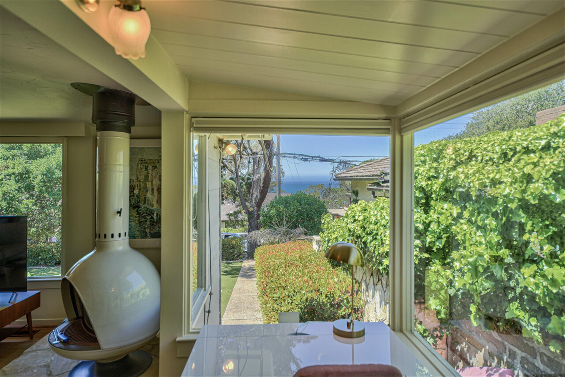 A Cozy Work Area with Desk and Peek of the Ocean