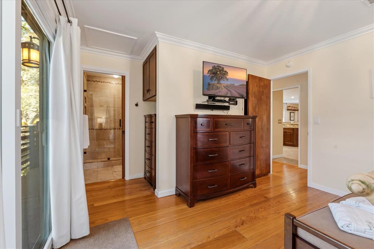 Bedroom 1, King Bed, TV, Balcony, EnSuite Bath with a Shower
