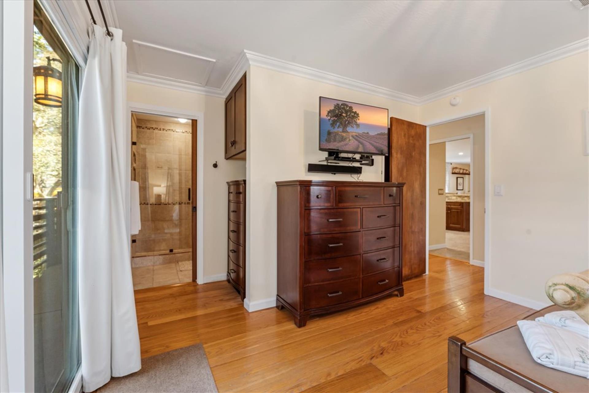 Bedroom 1, King Bed, TV, Balcony, EnSuite Bath with a Shower
