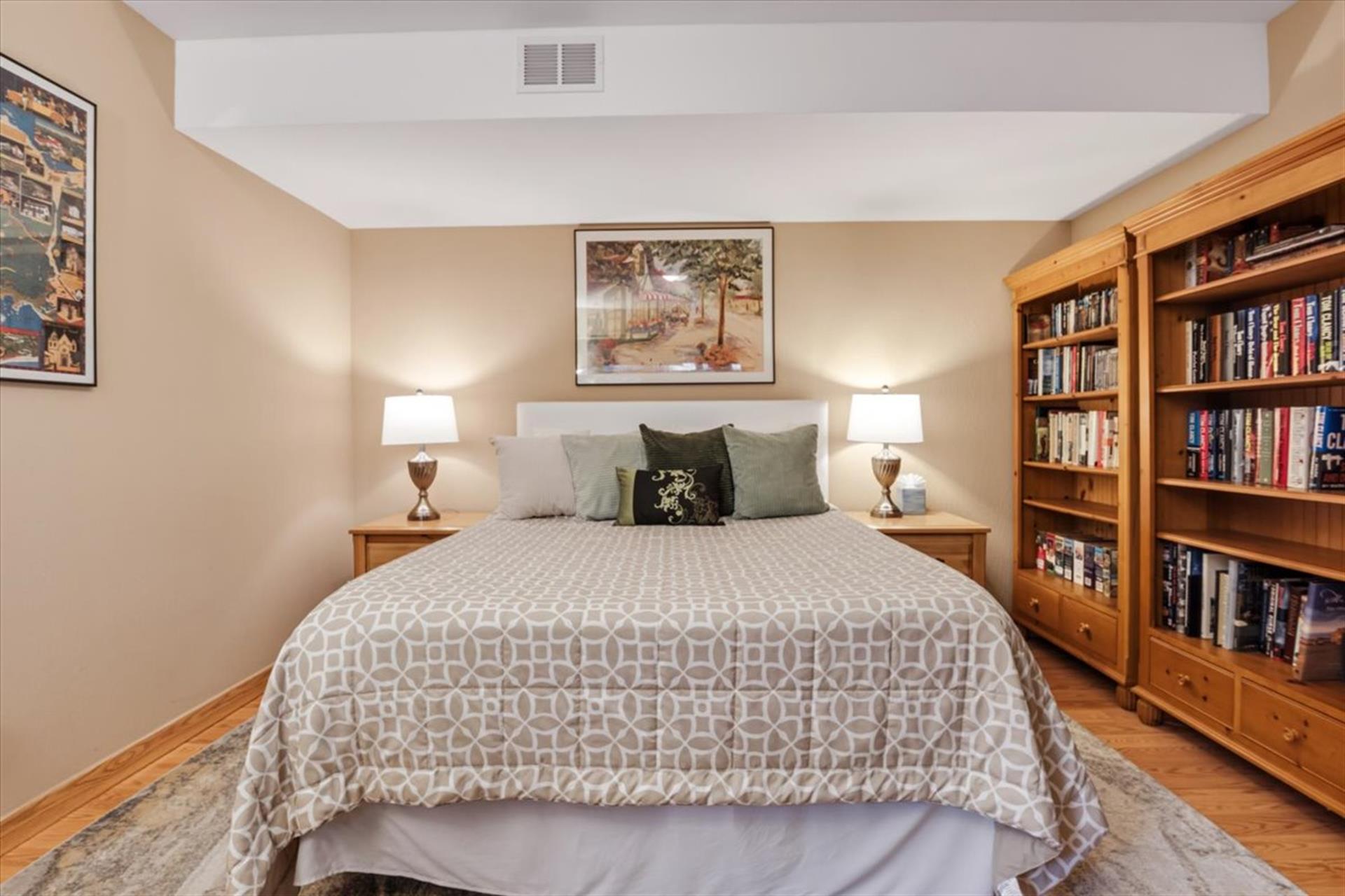 Bedroom 3, Queen Bed, TV and a Library of Books