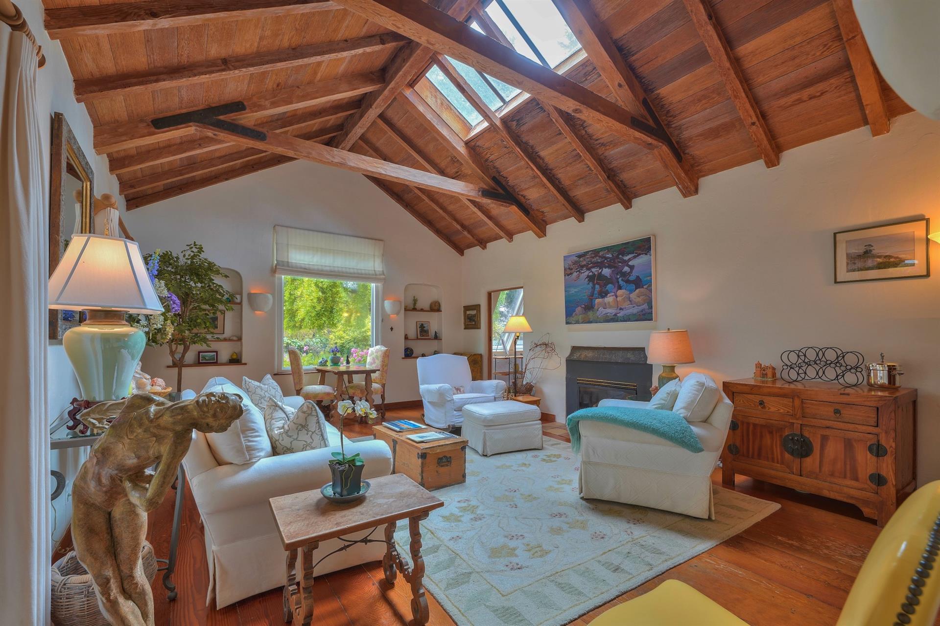 Gracious Living Room with Lofty Ceilings and Fireplace