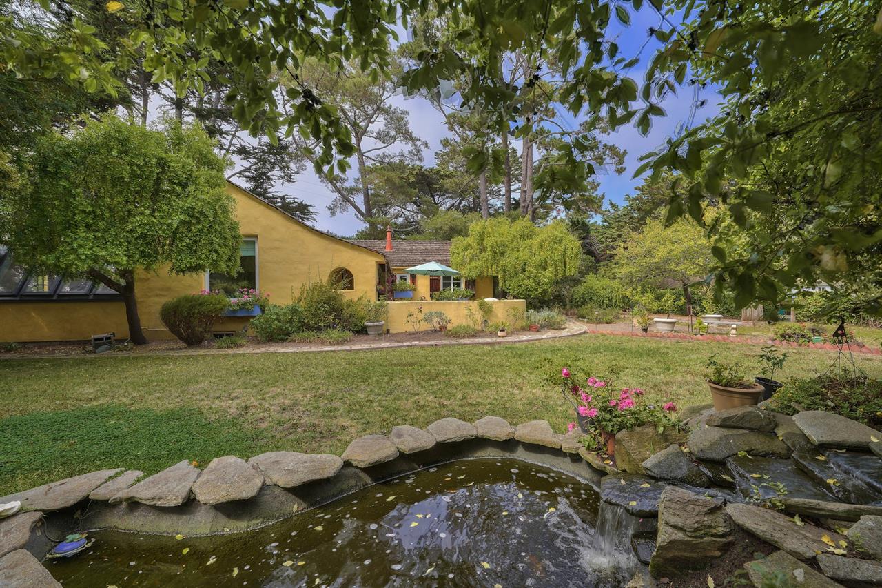 A Lovely Garden with a Pond Surrounds the Home
