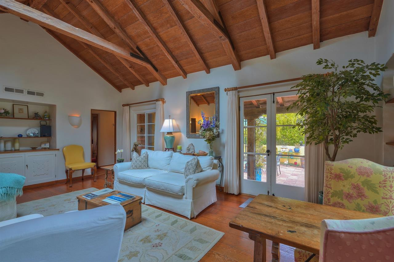 Living Room with French Doors, Wood Floors, Lofty Ceiling