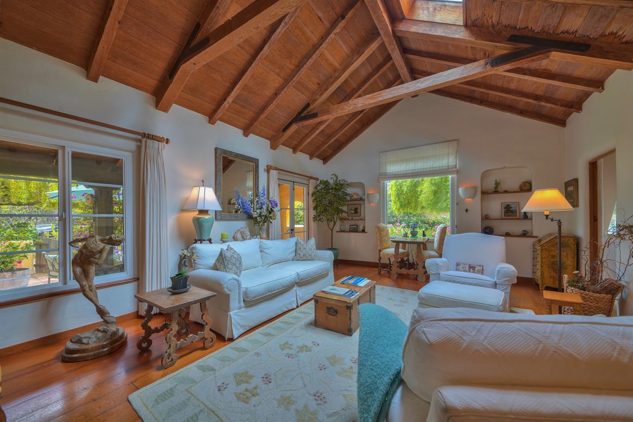 Living Room with French Doors, Wood Floors, Lofty Ceiling