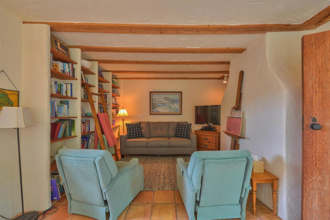 Den Has a Seating Area, Library and TV