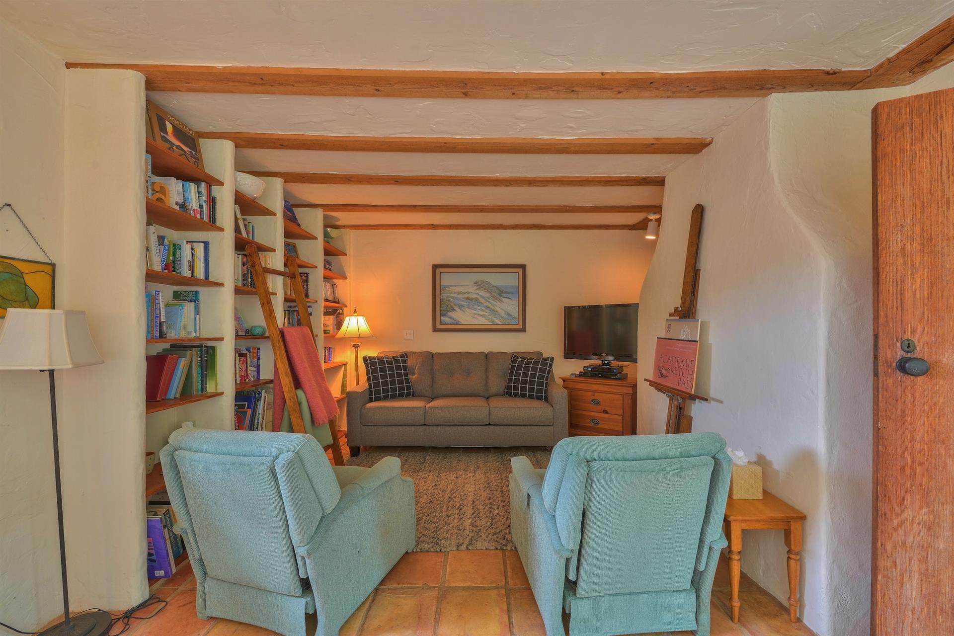 Den Has a Seating Area, Library and TV