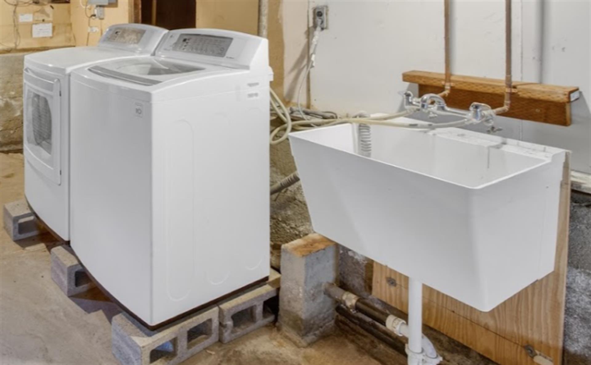 Washer, Dryer, Utility Sink in Unfinished Basement