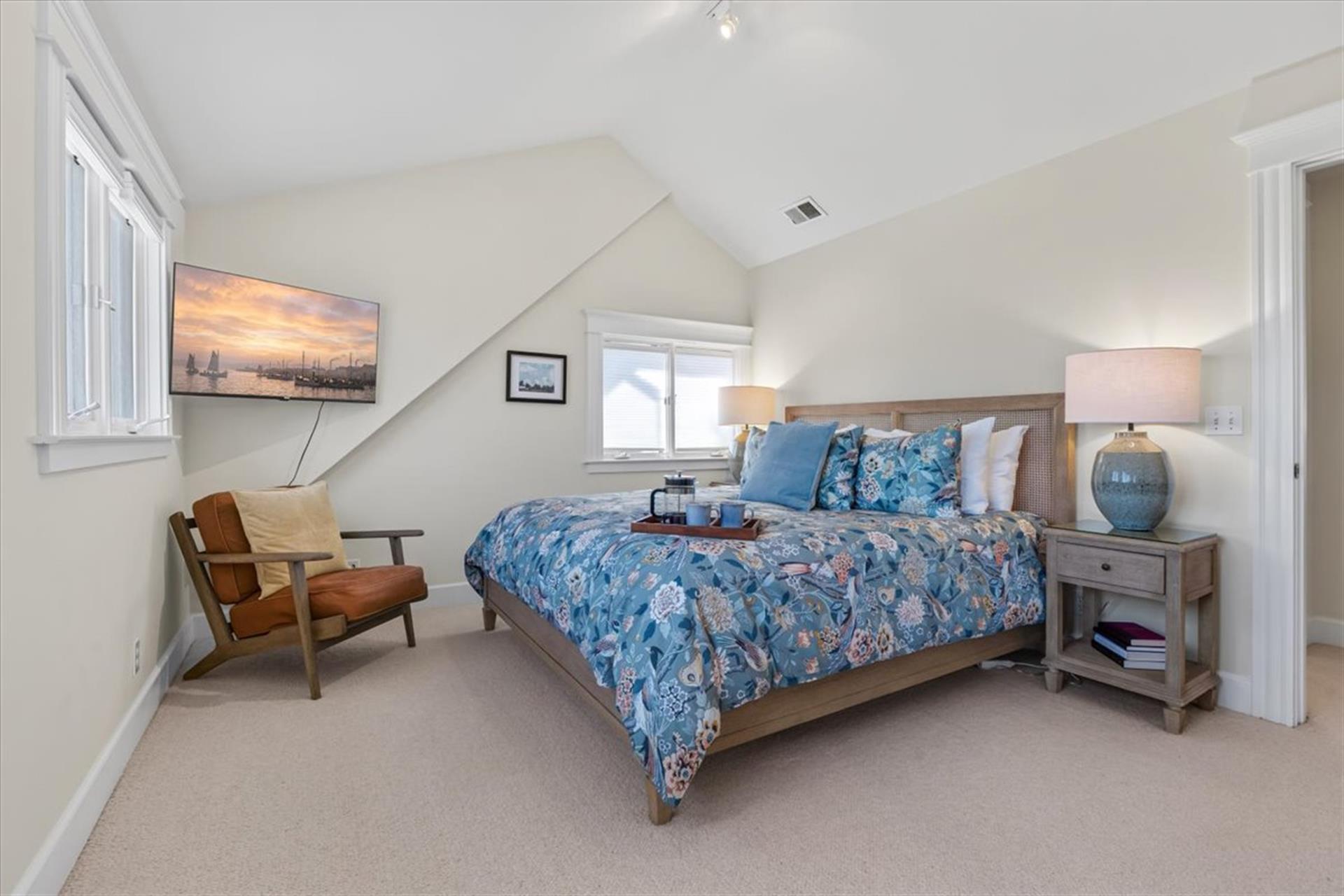 Bedroom 1 has a King Bed, Smart TV and EnSuite Bath