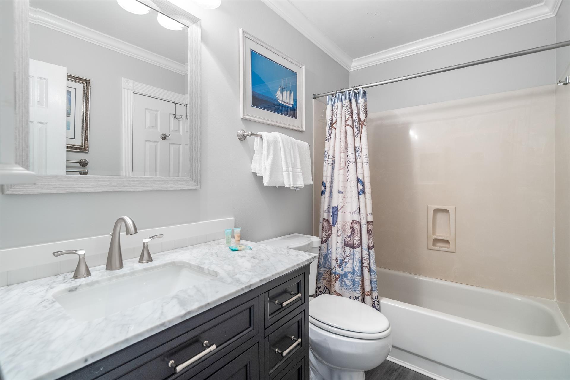 Bathroom with bathtubshower combination for the king bedroom 2.   Can be accessed directly from the bedroom as an ensuite or from the hallway.