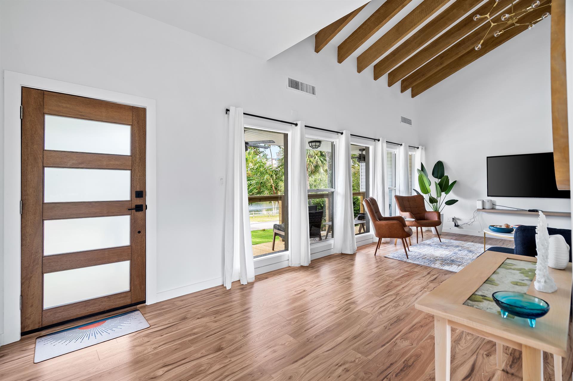 Entry door and living area into a Vaulted Ceiling and Newly Remodeled with a 70 Smart TV with Cable